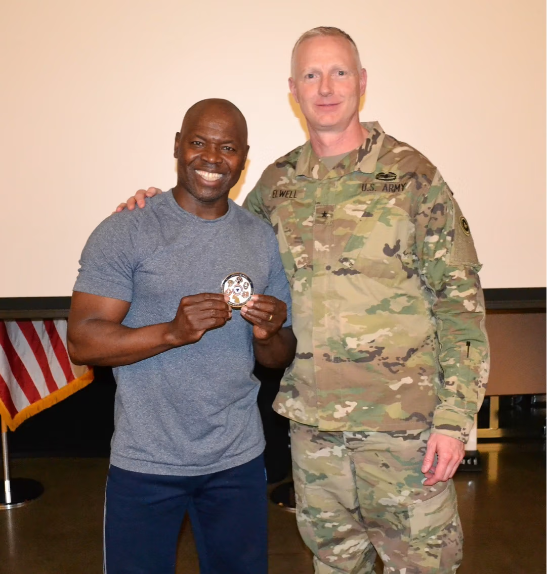 MisterG receiving recognition from a U.S. Army Commander