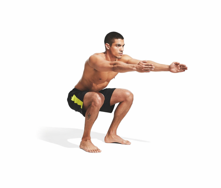Barefoot squat descent demonstrating lower-body control and mobility.
